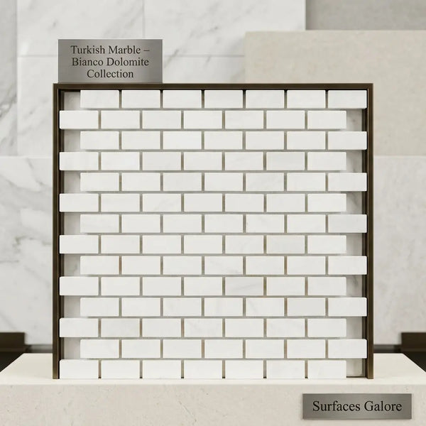 Bianco dolomite white dolomite 5/8x1 1/4 mini-brick mosaic marble tiles in a brick pattern framed by dark metal