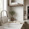 Stainless steel gooseneck faucet with a sleek modern design paired with bianco dolomite white dolomite mini-brick mosaic marble