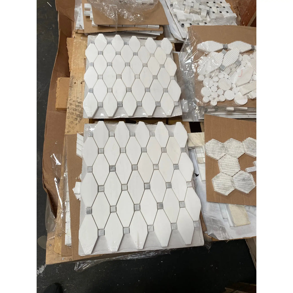 White dolomite octave long octagon mosaic marble tiles with silver grout arranged in a hexagonal repeating pattern