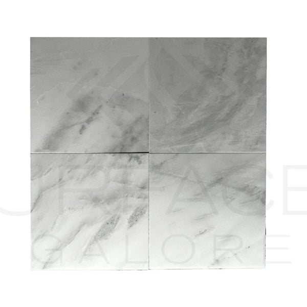 Four Bianco Venatino White Marble tiles showcasing elegant marble patterns