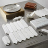 White hexagonal mosaic tiles made of premium Turkish Bianco Dolomite marble with subtle veining 3 by 12 inch picket pattern