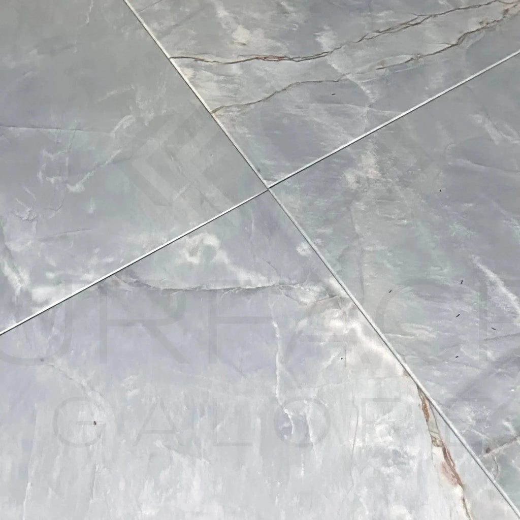 Gray marble floor tiles displayed as Blue Jade Marble 18X18 Polished Tile