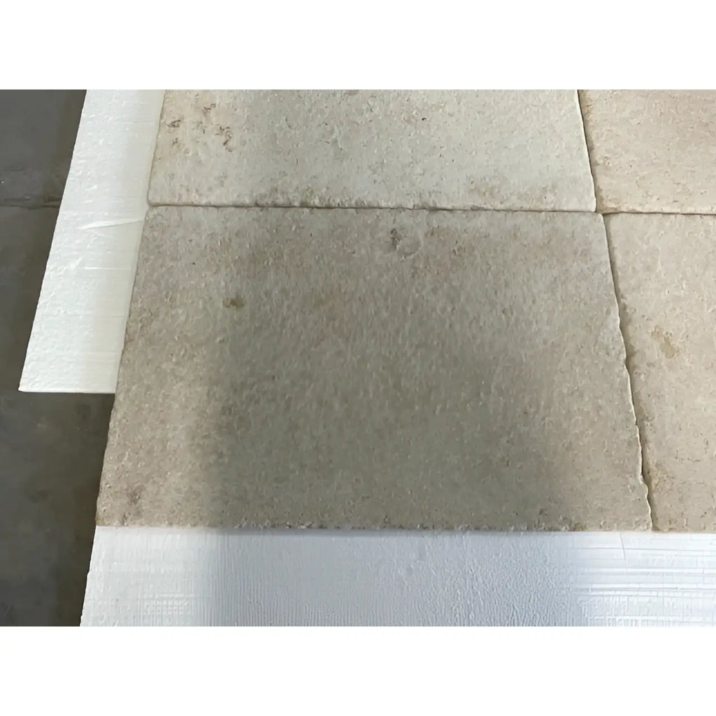 Bordeaux Rustique 16x24 limestone aged beige stone tiles with textured surface