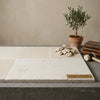 Beige Bordeaux Rustique limestone aged stone tiles with natural rough texture and subtle tone variations 16x24 inches