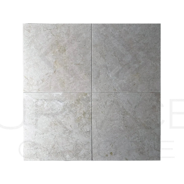 Four gray marble tiles showcasing Botticino Cream White Beige Marble Polished Tile
