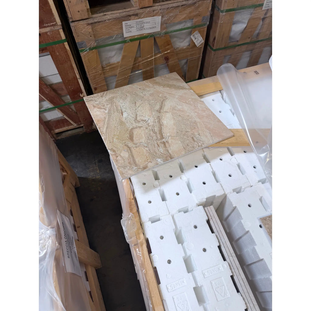 A beige textured stone tile with natural veining in breccia oniciata italian marble 18x18 honed polished finish