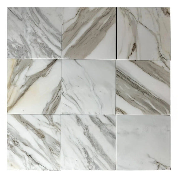 Nine Calacatta Borghini Gold polished marble tiles displayed for sale