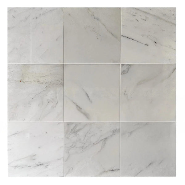 Nine square Calacatta Carrara polished marble tiles in a 300 sq. ft. product display