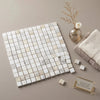 Square mosaic tile panel of calacatta gold italian marble with subtle white beige and gray veining polished or honed