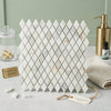 White calacatta gold marble mosaic tile with diamond pattern and subtle veining polished or honed finish
