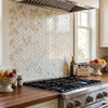 Beige and gold veined calacatta gold 1x2 polished or honed italian marble tiles arranged in herringbone pattern