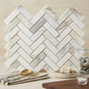White marble calacatta gold 1x3 polished herringbone mosaic tile arranged in a classic herringbone pattern
