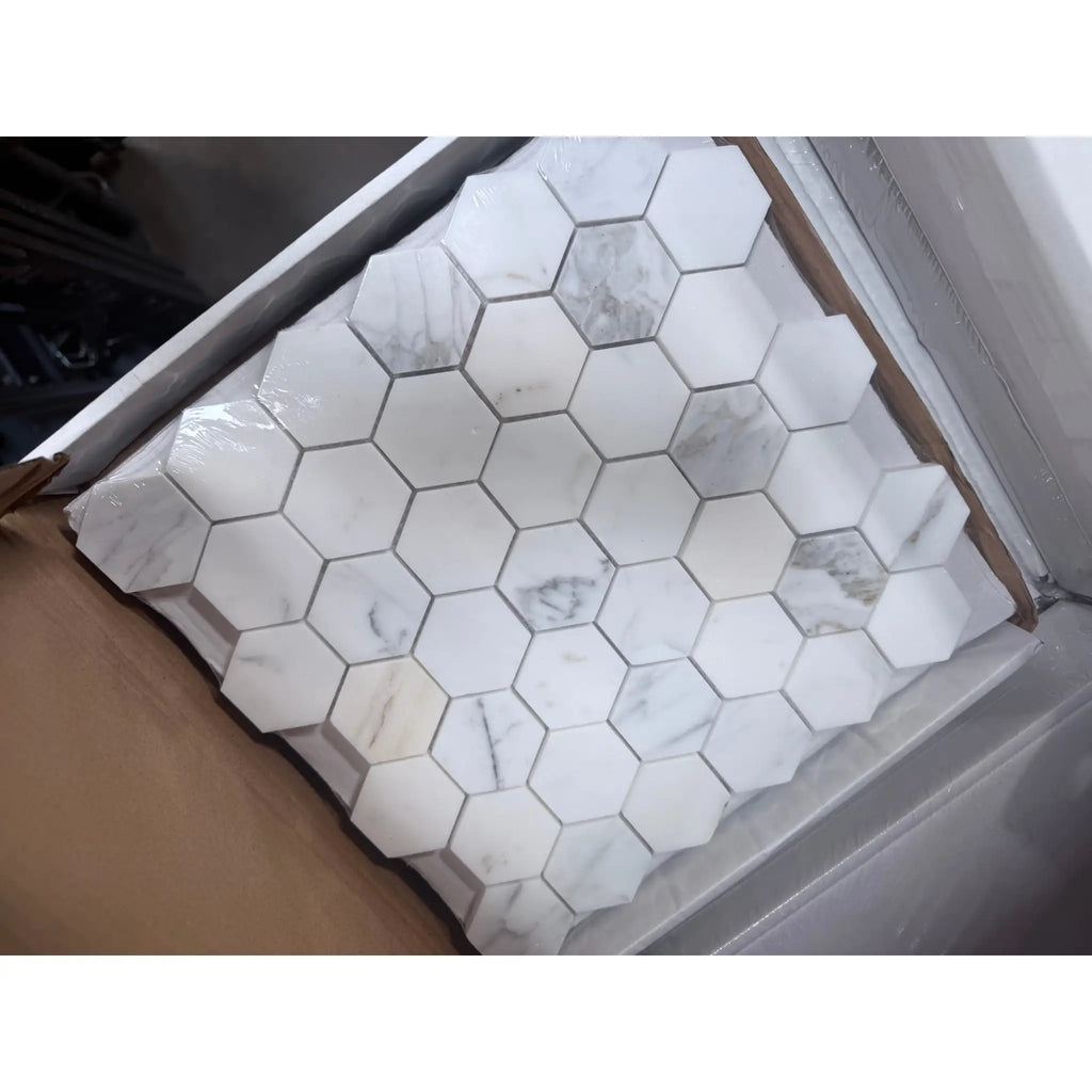 Calacatta Gold 2-inch white hexagon marble mosaic tile sheet with gray veining
