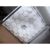 Calacatta Gold 2-inch white hex marble mosaic tile with gray veining in plastic
