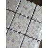 White hexagonal calacatta gold marble mosaic tile with subtle gray veining polished or honed finish