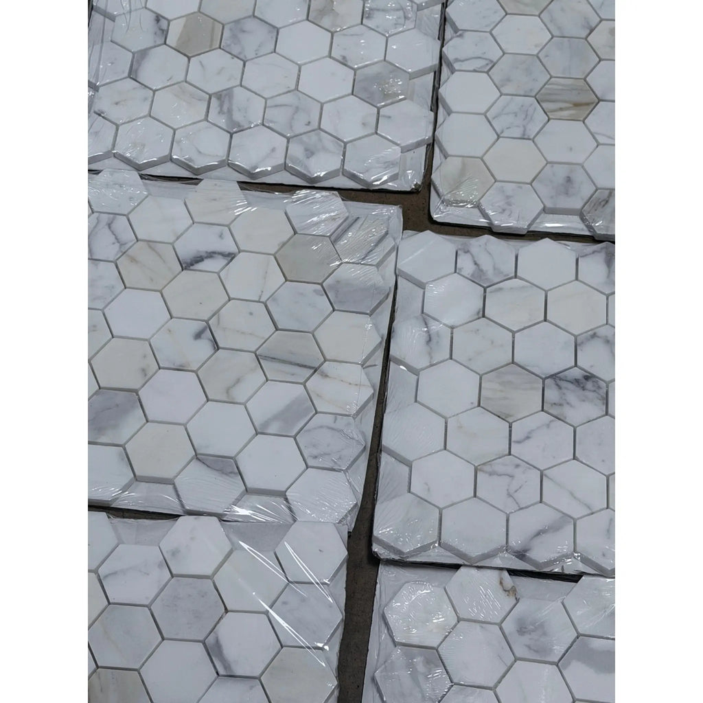 Calacatta Gold 2 inch hexagon mosaic marble tile polished with white hexagonal marble and subtle gray veining packaged in plastic