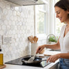 White hexagonal calacatta gold italian marble mosaic tile with subtle gray veining polished or honed finish