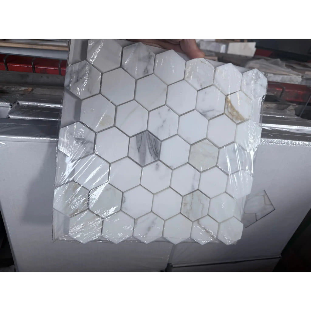 Calacatta Gold 2-inch white hex marble mosaic tile sheet in plastic