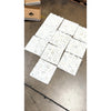 White hexagonal Calacatta Gold marble mosaic tile with subtle veining polished or honed finish