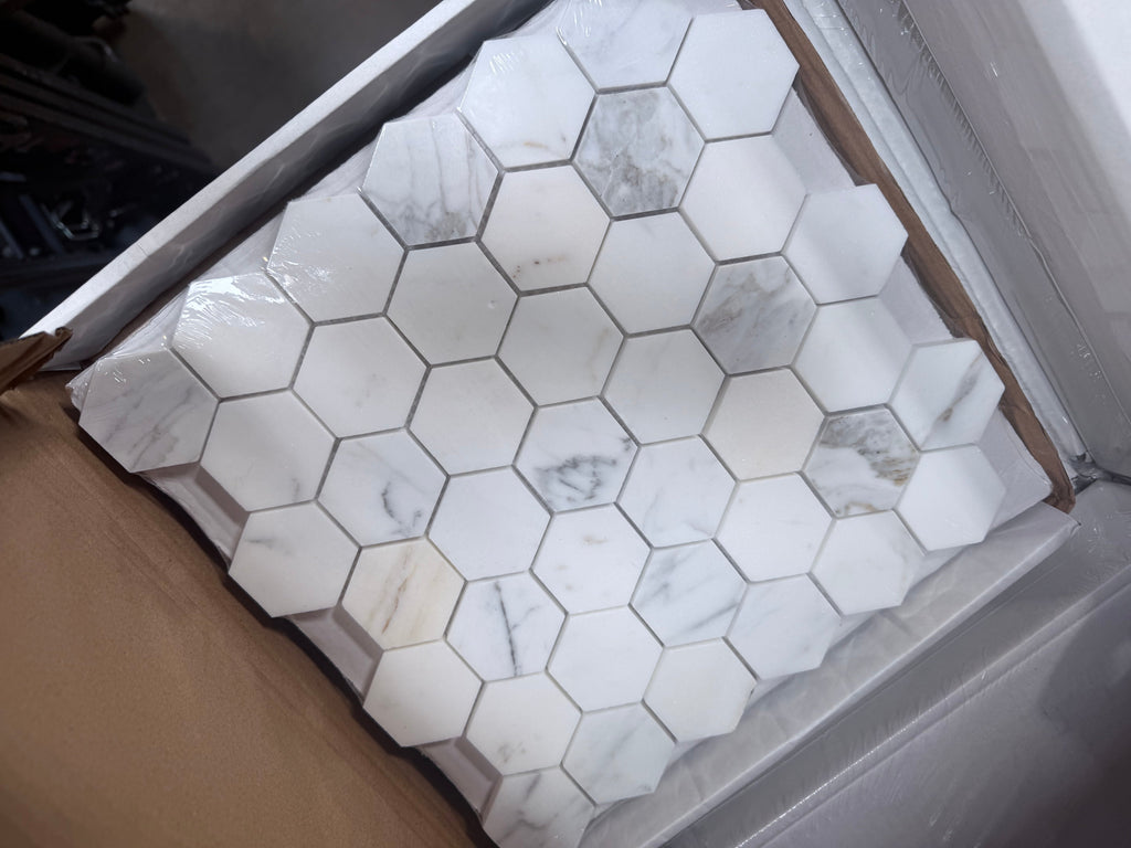 Calacatta Gold 2-inch white hexagon marble mosaic tile sheet with gray veining