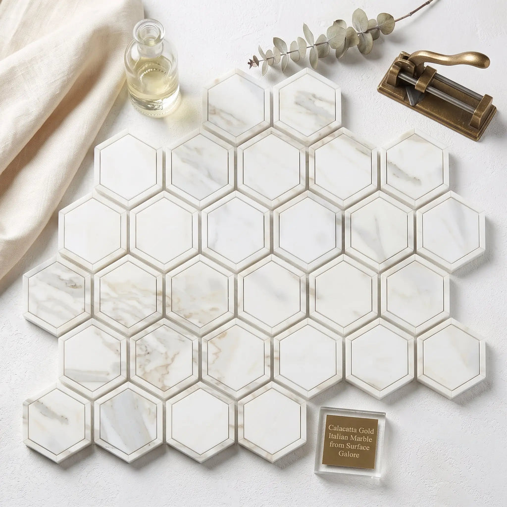 Calacatta gold 2 inch vortex hexagon mosaic marble tile with white hexagonal tiles gray veining and thin gold border