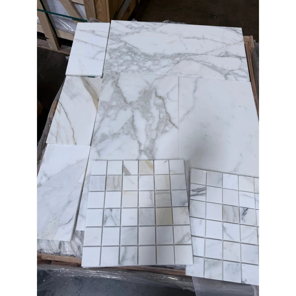 White marble tile with gray veining and glossy finish from Calacatta Gold Mosaic collection