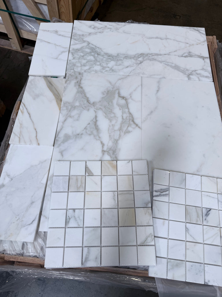 White marble tile with gray veining and glossy finish from Calacatta Gold Mosaic collection