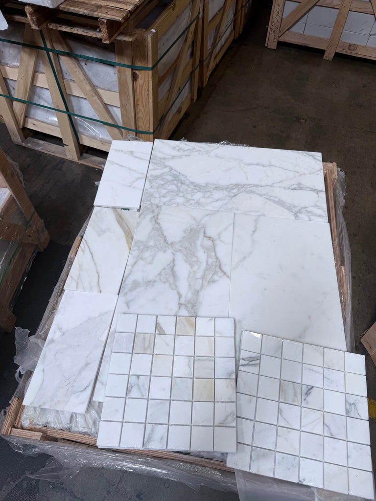 White marble tile with gray veining from Calacatta Gold 2x2 Mosaic collection