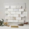 Calacatta gold 2x4 brick mosaic marble tile panel featuring white italian marble with subtle gold veining and polished finish