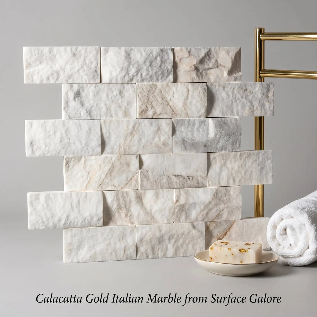 Calacatta gold 2x4 brick split-faced mosaic marble tile featuring white and gold veined italian marble in stacked stone pattern