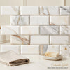 Calacatta gold 2x4 deep-beveled brick mosaic marble tile polished-honed with white and gold veined italian marble