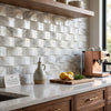 Calacatta gold 2x4 round-faced mosaic marble tile in white and gray with elegant veining polished or honed finish