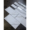 Calacatta Gold white marble-effect 4 3/4x12 baseboard trim with gray veining and silver foil accents