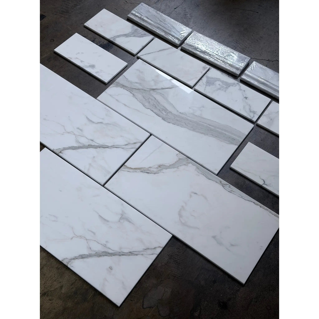 Calacatta Gold white marble-effect baseboard trim with gray veining