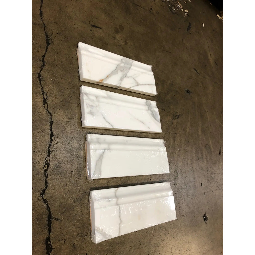 Calacatta gold 4 3/4x12 white marble baseboard trim molding with elegant gray veining wrapped in clear plastic