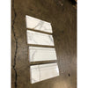 White marble calacatta gold 4 3/4x12 baseboard trim molding with subtle gray veining and polished or honed finish