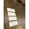 Calacatta gold 4 3/4x12 white marble baseboard trim molding with subtle gray veining polished or honed finish