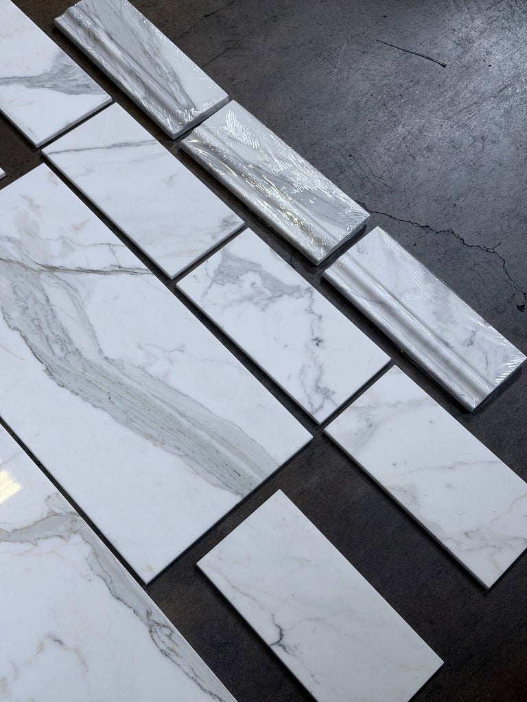 Calacatta Gold 4 3/4x12 polished white marble baseboard trim with gray veining