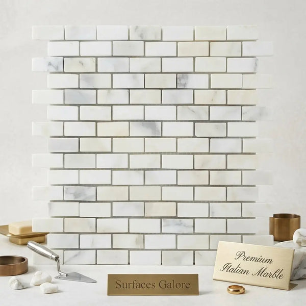 White italian marble calacatta gold mini-brick mosaic tile with subtle gray veining in a polished or honed finish