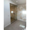 Glass-enclosed shower featuring Calacatta Gold Hexagon Mosaic Marble Tile walls