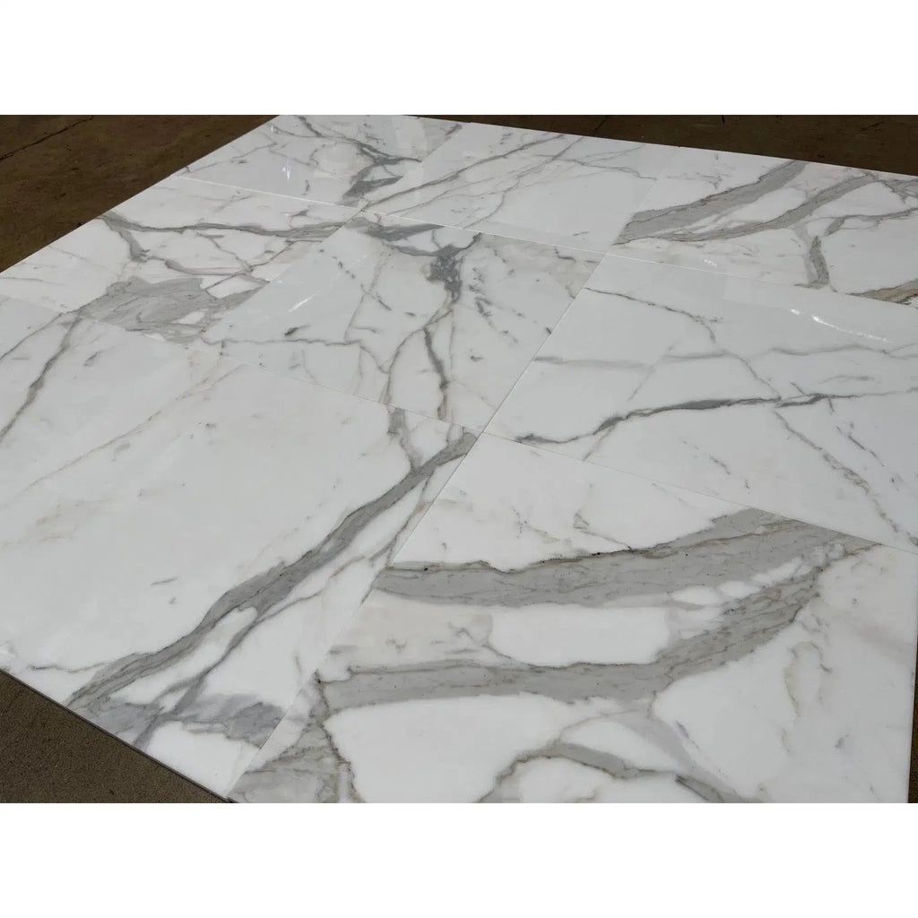 White marble tile with gray veining in Calacatta Gold 5 inch hexagon mosaic design