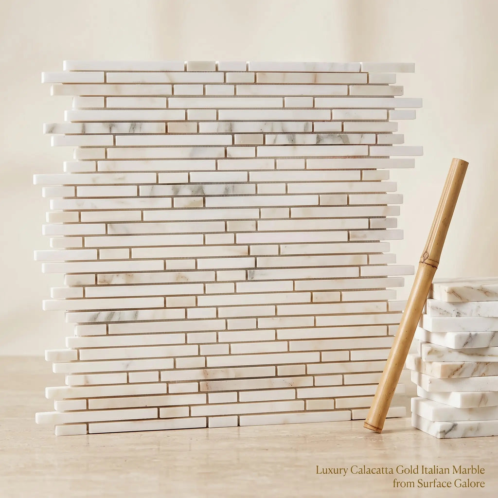 Luxury calacatta gold italian marble bamboo sticks mosaic tile in a sleek stacked brick pattern with elegant veining