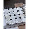 Calacatta Gold basketweave mosaic marble tile with black accents, polished or honed