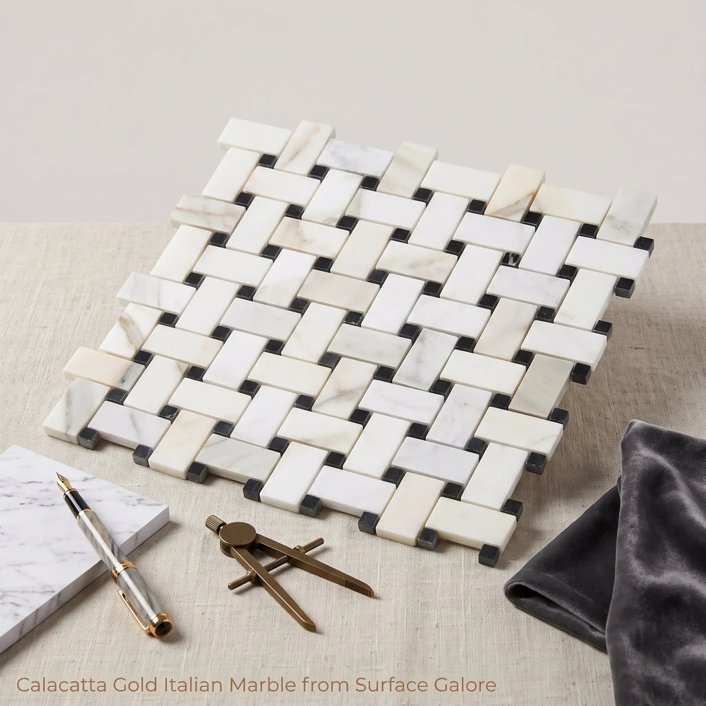 Calacatta gold basketweave mosaic marble tile with white and gold veined calacatta gold and dark gray grout
