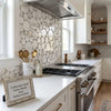 Calacatta gold bubbles mosaic marble tile polished or honed featuring circular white and gray veined tiles backsplash
