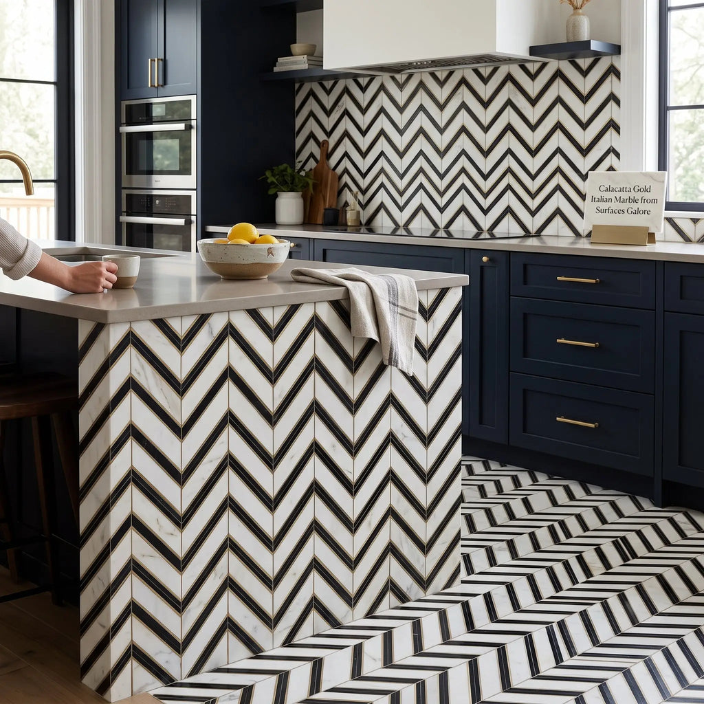 Black and white chevron-patterned calacatta gold mosaic marble tile kitchen island with polished modern design