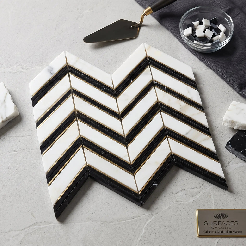 Calacatta gold chevron large black mosaic marble tile polished with gold grout in chevron pattern