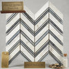 Calacatta Gold chevron large mosaic marble tile polished or honed white and gray italian marble with blue-gray tones and dark grout lines