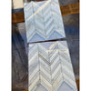 Calacatta Gold Chevron large polished mosaic marble tile with white chevron pattern and dark grout
