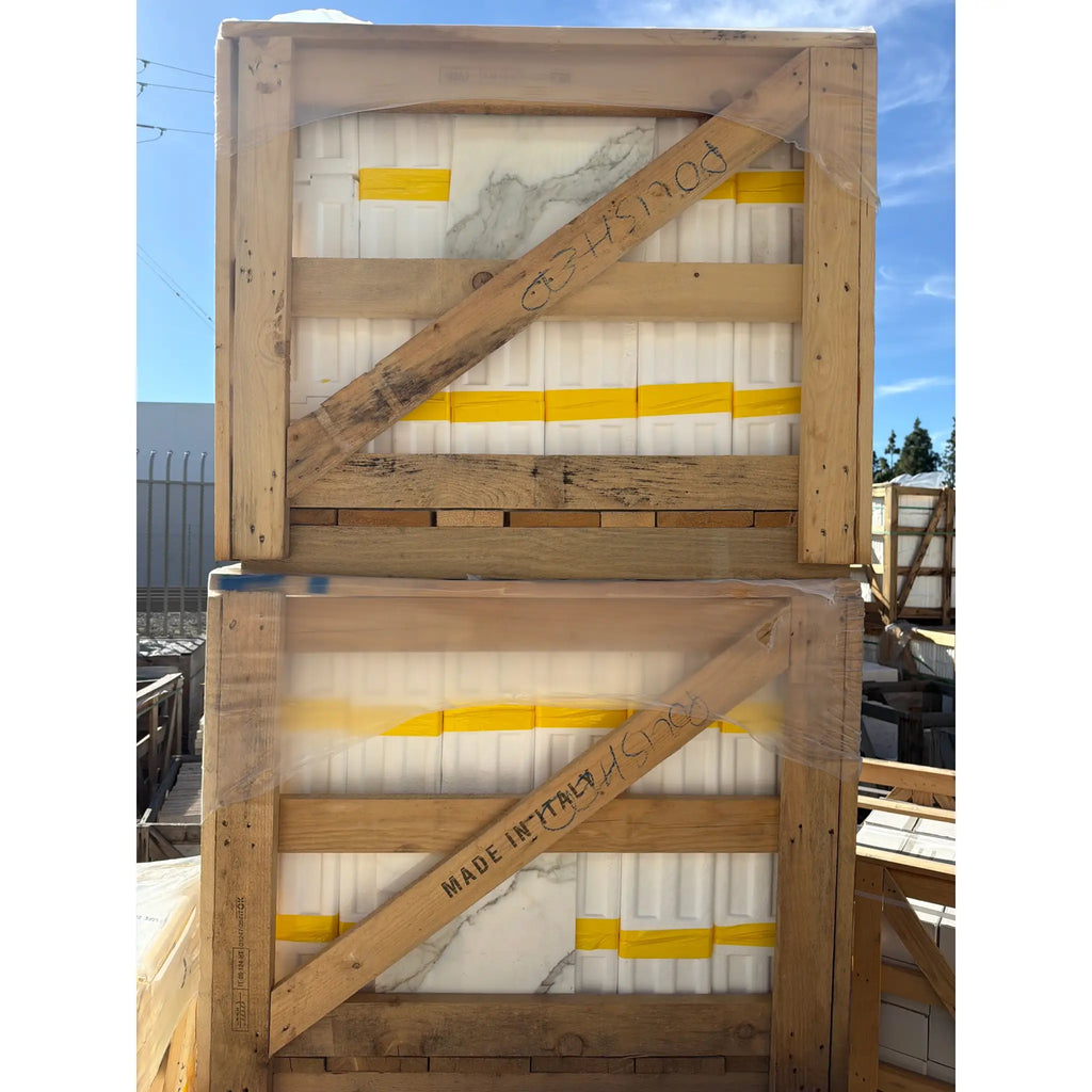 Calacatta Gold Marble 12x12 Polished tiles in stacked, plastic-wrapped crates